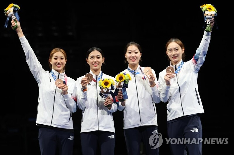 (Olympics) Fencing team rallies for bronze, football team sent home after humiliating loss