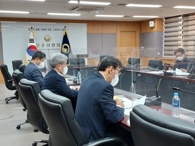 Top financial regulator urges market monitoring over Evergrande concerns
