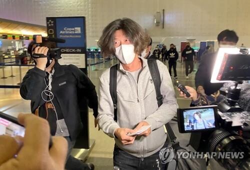 Key figure in land development corruption scandal heads home from U.S. for probe