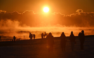 Tourists watch sunrise