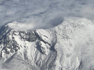 [K-Geography] Aerial view of snow-capped crater lake