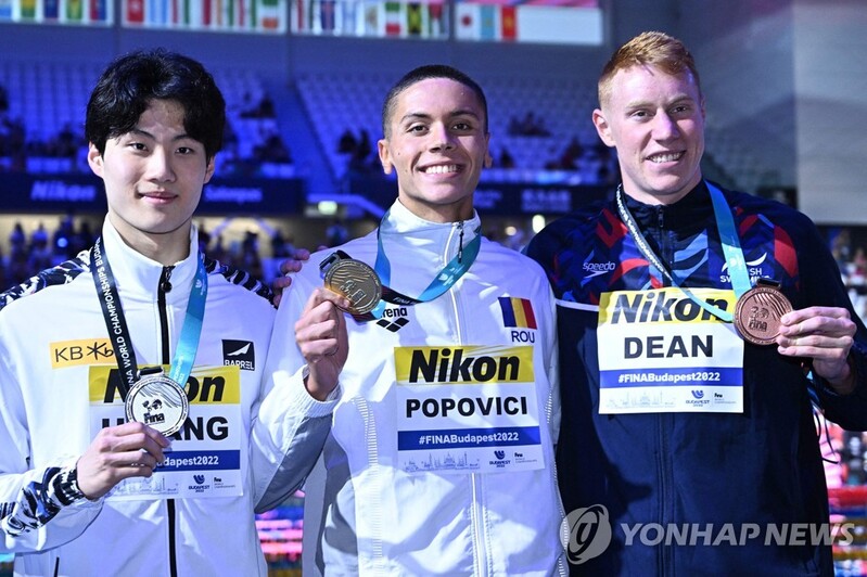 (LEAD) Teen swimmer reaches next level in burgeoning career with world championships silver