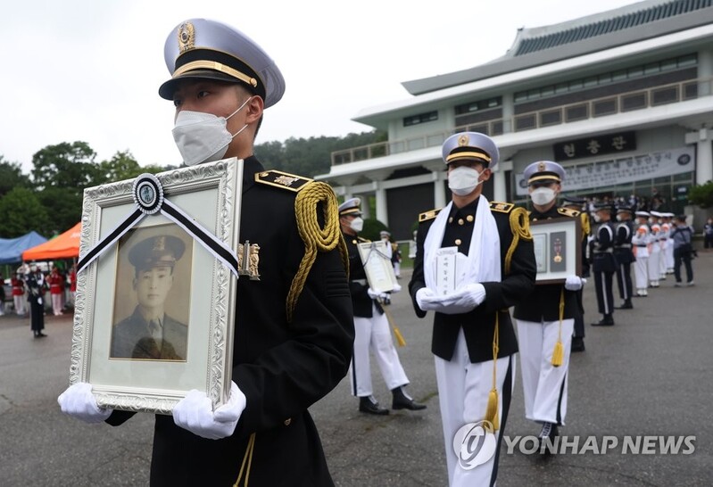 Remains of 12 Korean War troops interred at national cemeteries