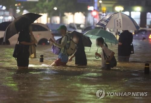 Heavy rain-caused deaths stand at 14; number of missing revised down to 4