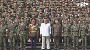 Kim Jong-un takes group photo with officials from anti-pandemic sector