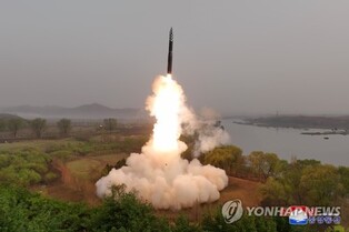 (3rd LD) N. Korea says it tested new solid-fuel ICBM for 1st time