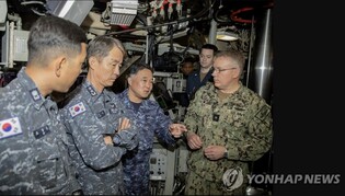 U.S. military discloses photos of S. Korean, U.S., Japanese officials boarding nuclear missile sub