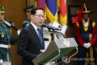 Ex-Defense Minister Song's home, office raided over suspected abuse of power