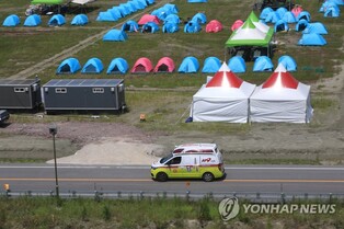 (LEAD) Rival parties call for safety measures at jamboree event amid heat wave