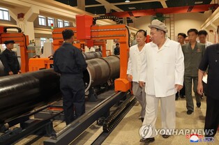 (LEAD) N. Korean leader inspects major weapons factories: state media
