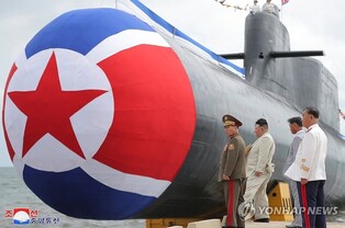 (LEAD) N. Korea says it launched new 'tactical nuclear attack submarine'