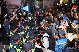 (LEAD) Opposition leader's supporters protest approval of arrest motion