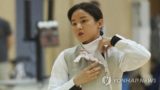Fencer booked on suspicion of colluding in ex-fiance's alleged fraud