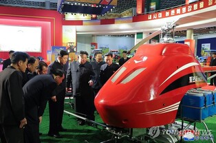 N. Korean leader attends farm machinery exhibition