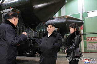 N. Korean leader inspects factory producing launchers for solid-fuel ICBMs