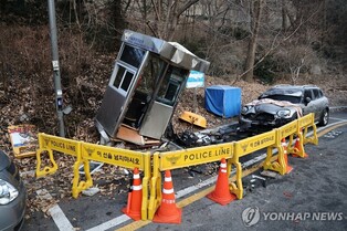 (LEAD) Car rams into guard post at Russian ambassador's residence, injures police officer