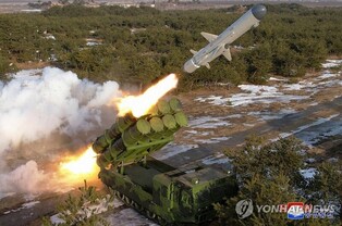(LEAD) N.K. leader oversees test-fire of new surface-to-sea missile