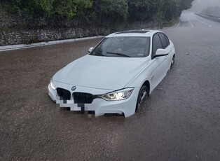 Car stranded on flooded road