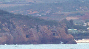 N.K. artillery positions open