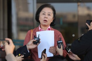 Ex-lawmaker embroiled in scandal appears before prosecutors
