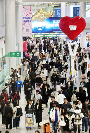Airport bustles with outbound holiday tourists