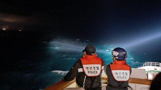 Search efforts continue overnight, but no trace of 2 missing crew members: Coast Guard