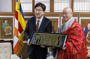 Ruling party's whip meets Buddhist sect's leader