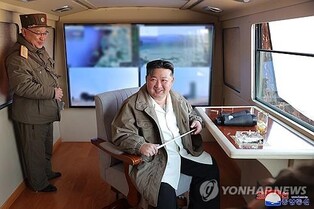 (LEAD) N. Korea's Kim supervises test-firing of new air defense missiles: KCNA