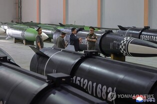 (LEAD) N. Korea's Kim inspects new missile production line ahead of planned trip to China