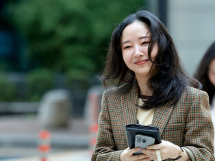 Photos of former ADOR chief Min Hee-jin, appearing at court
