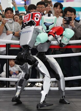 Humanoid robots fight in kickboxing competition