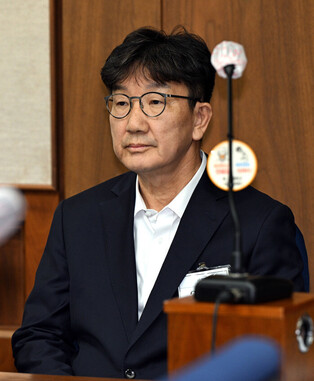 Opposition lawmaker attends 1st hearing of bribery trial