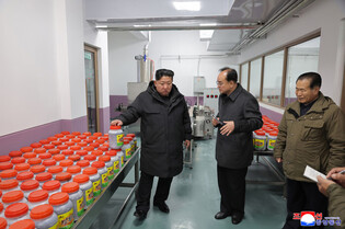 N.K. leader inspects regional factories ahead of official opening