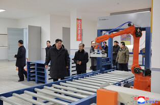 N.K. leader inspects regional factories ahead of official opening