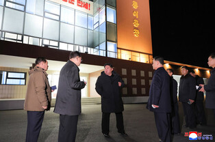 N.K. leader inspects regional factories ahead of official opening