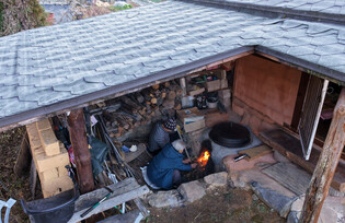 Wood-burning stove in traditional heating system