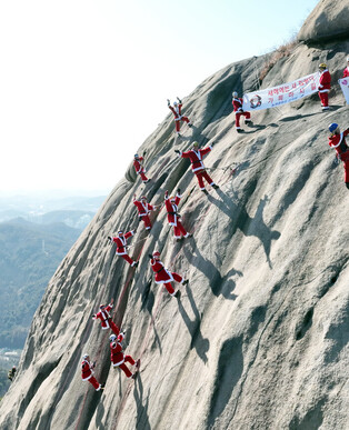 Santa climbing mountain