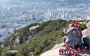 Santa climbing mountain