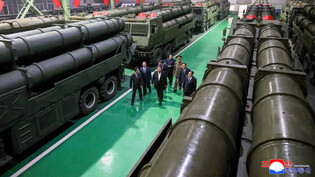 N.K. leader inspects factory producing multiple rocket launchers