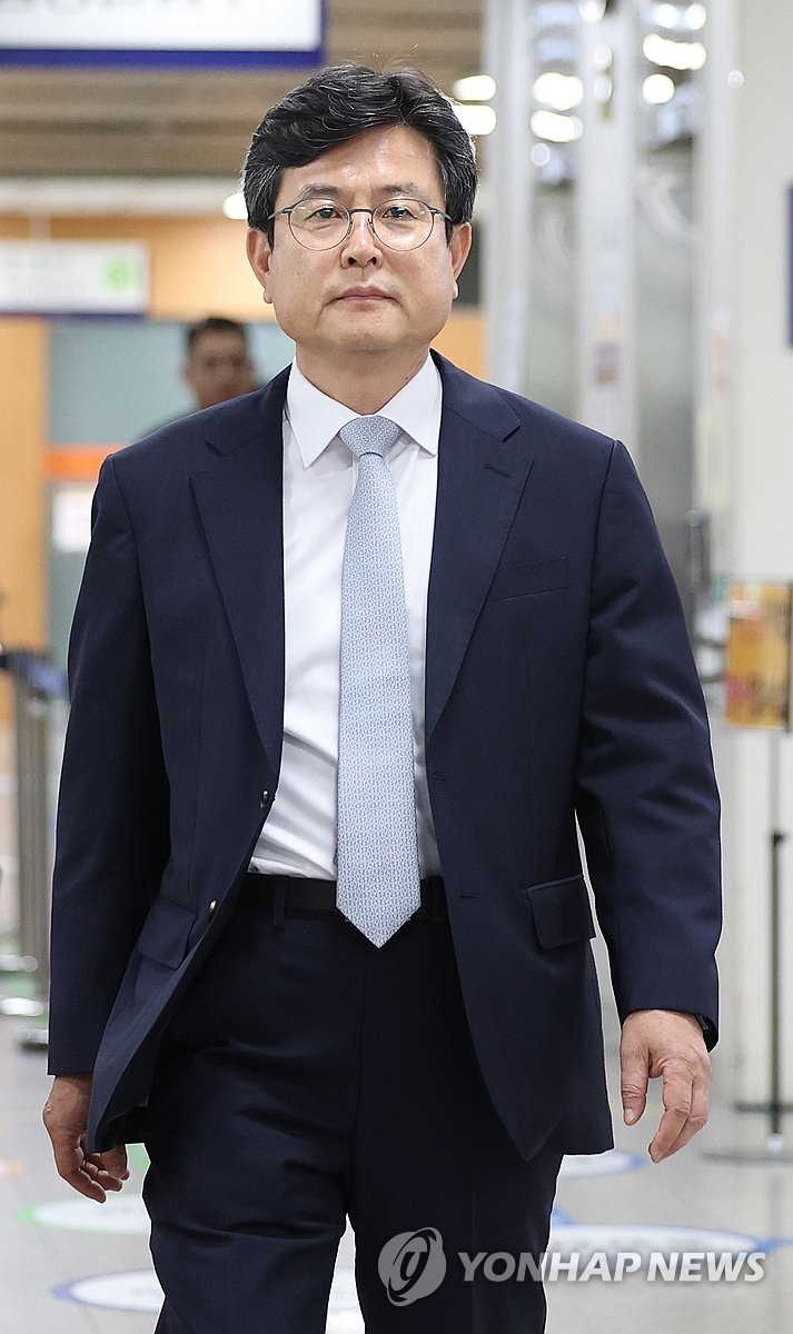  Kang Eui-gu, a former presidential secretary, appears at the Seoul Central District Court in the capital in this file photo taken May 28, 2026, to hear the verdict on his trial over charges of drafting a false document in connection with former President Yoon Suk Yeol's failed 2024 martial law bid. The court sentenced Kang to 18 months in prison for the charges. (Yonhap)