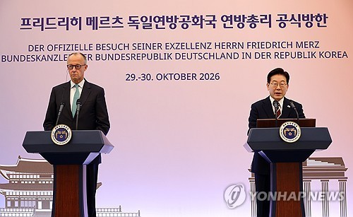President Lee Jae Myung (R) and German Chancellor Friedrich Merz speak during a joint press announcement at Cheong Wa Dae in Seoul following their summit on Oct. 29, 2026. (Yonhap)