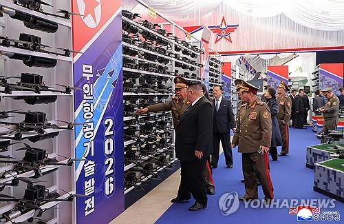 North Korean leader Kim Jong-un (front, L) views exhibits at the "Unmanned Aeronautical Technology Development-2026" exhibition in Pyongyang on Oct. 29, 2026, in this photo released by the Korean Central News Agency on Oct. 30, 2026. (For Use Only in the Republic of Korea. No Redistribution) (Yonhap)