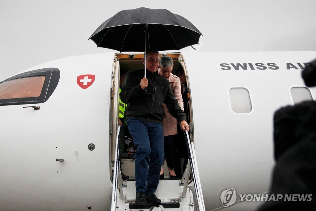 This AP photo shows Swiss Foreign Minister Ignazio Cassis getting off a plane upon arrival at Pyongyang International Airport on Oct, 30, 2026. (PHOTO NOT FOR SALE) (Yonhap)