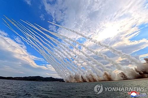 North Korea's 600-millimeter multiple rocket launcher, known as "Sniper," launches rockets during a firing demonstration attended by leader Kim Jong-un on Oct. 29, 2026, in this photo released by the Korean Central News Agency the following day. (For Use Only in the Republic of Korea. No Redistribution) (Yonhap)